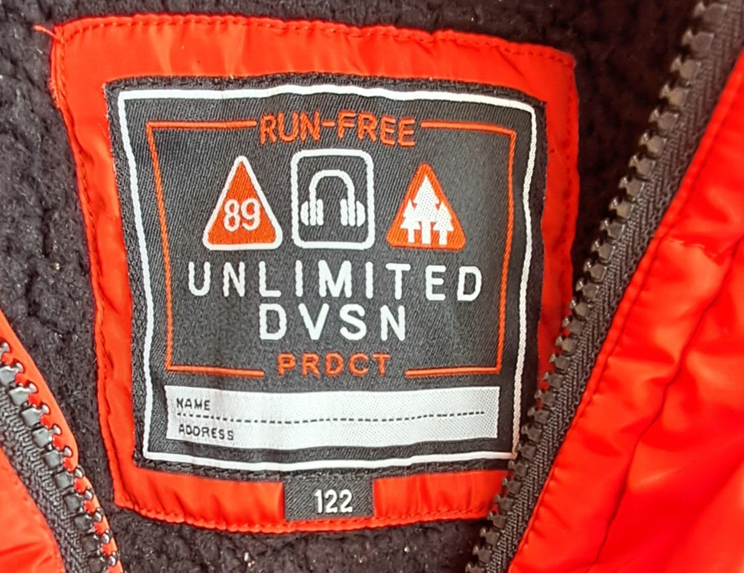 Stoere oranje winterjas maat 122, Ophalen, Gebruikt, Jongen of Meisje, Unlimited DVSN