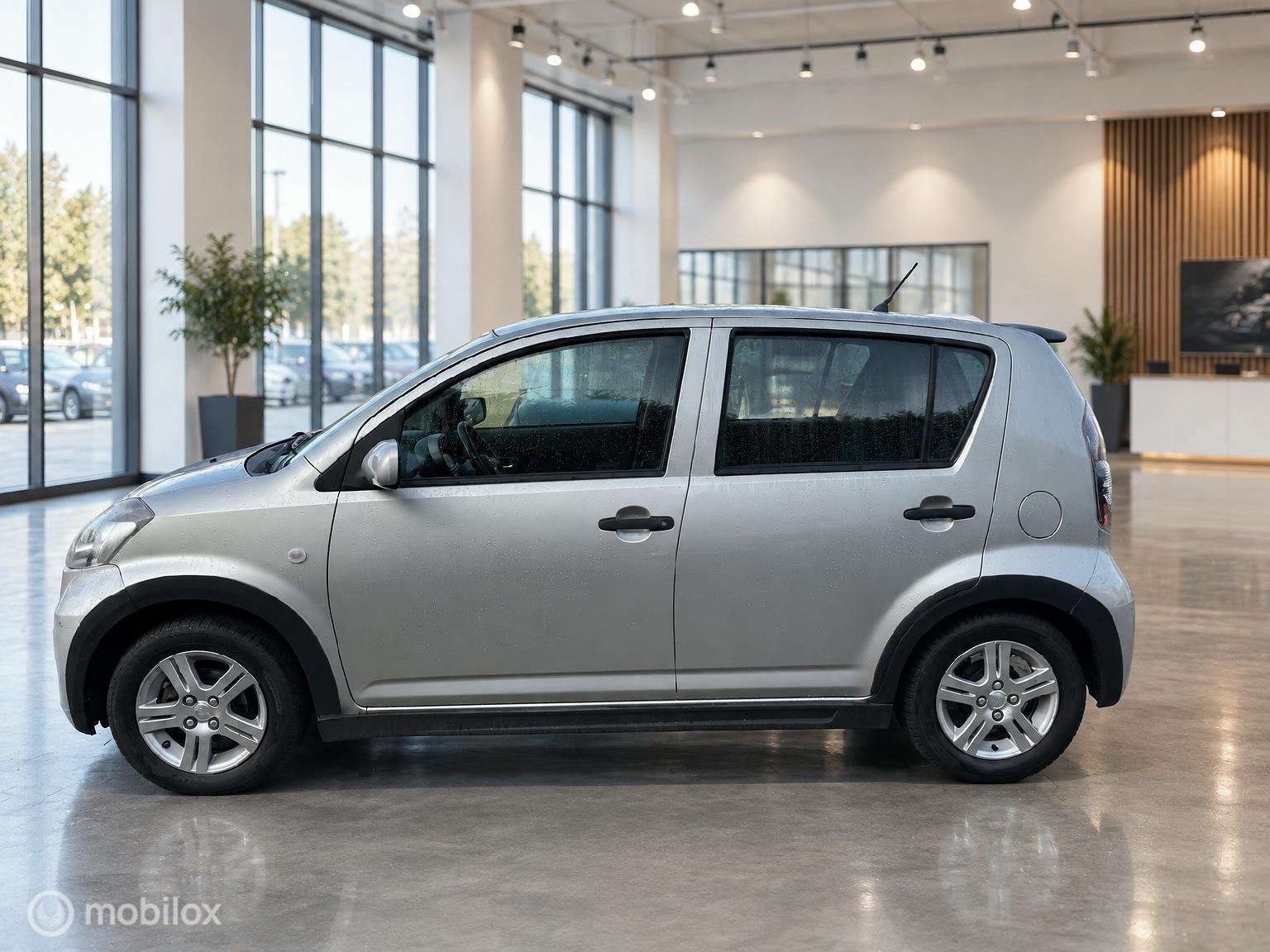 Daihatsu Sirion 2 1.0-12V Premium, Auto's, Voorwielaandrijving, Gebruikt, Beige, Bedrijf