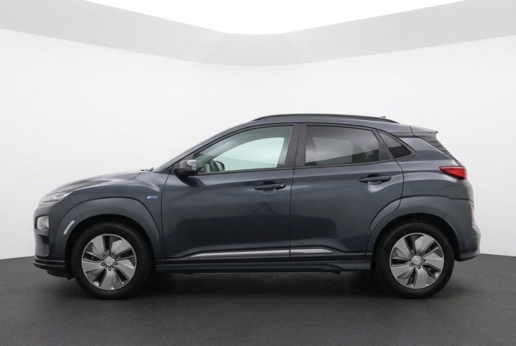 Hyundai KONA EV Premium 64 kWh 100% SOH Origineel NL | Leder, Auto's, Automaat, 0 cilinders, Gebruikt, Leder