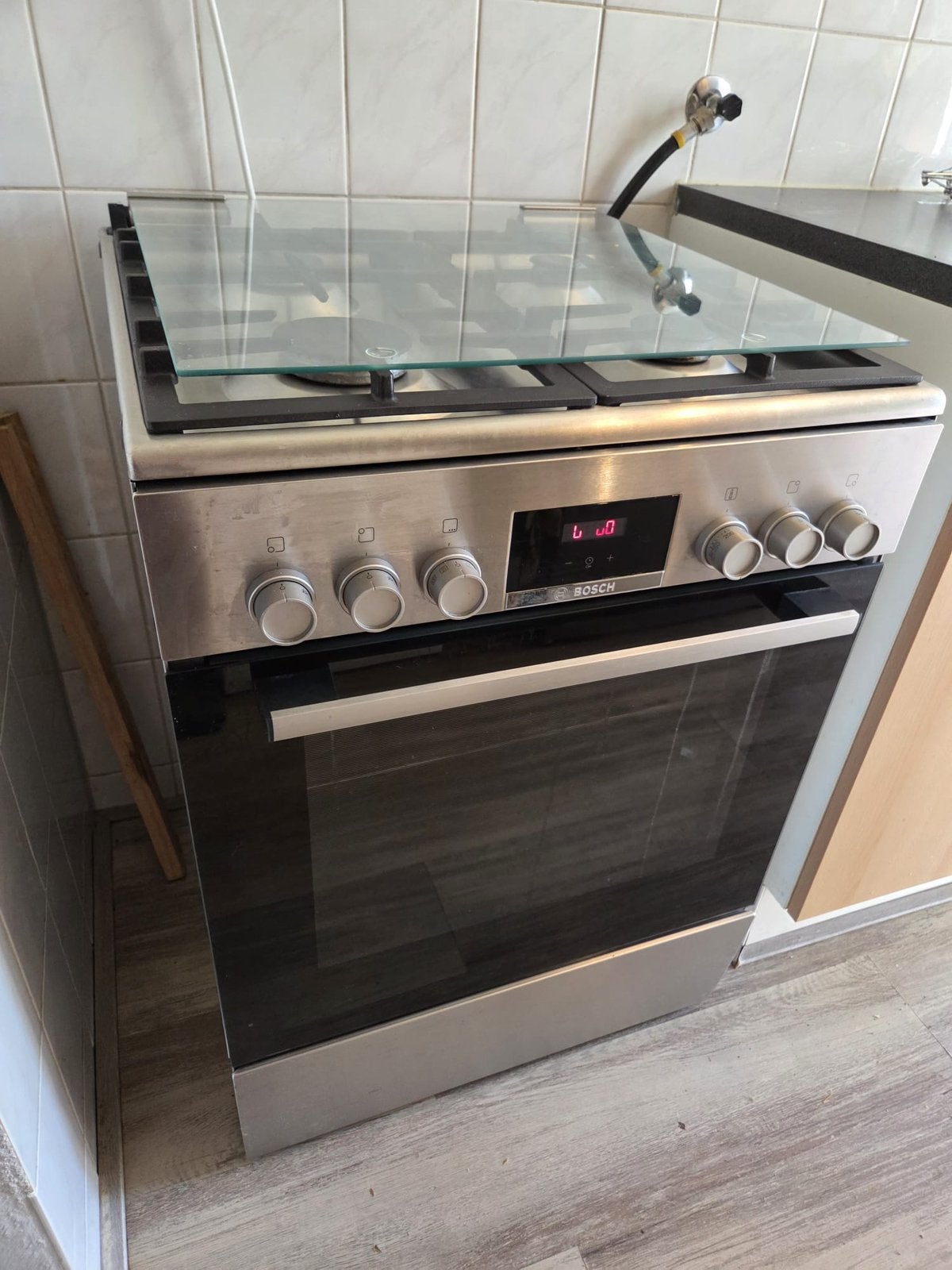 Bosch gasfornuis RVS serie 4, Ophalen, 4 kookzones, Zo goed als nieuw, Gas
