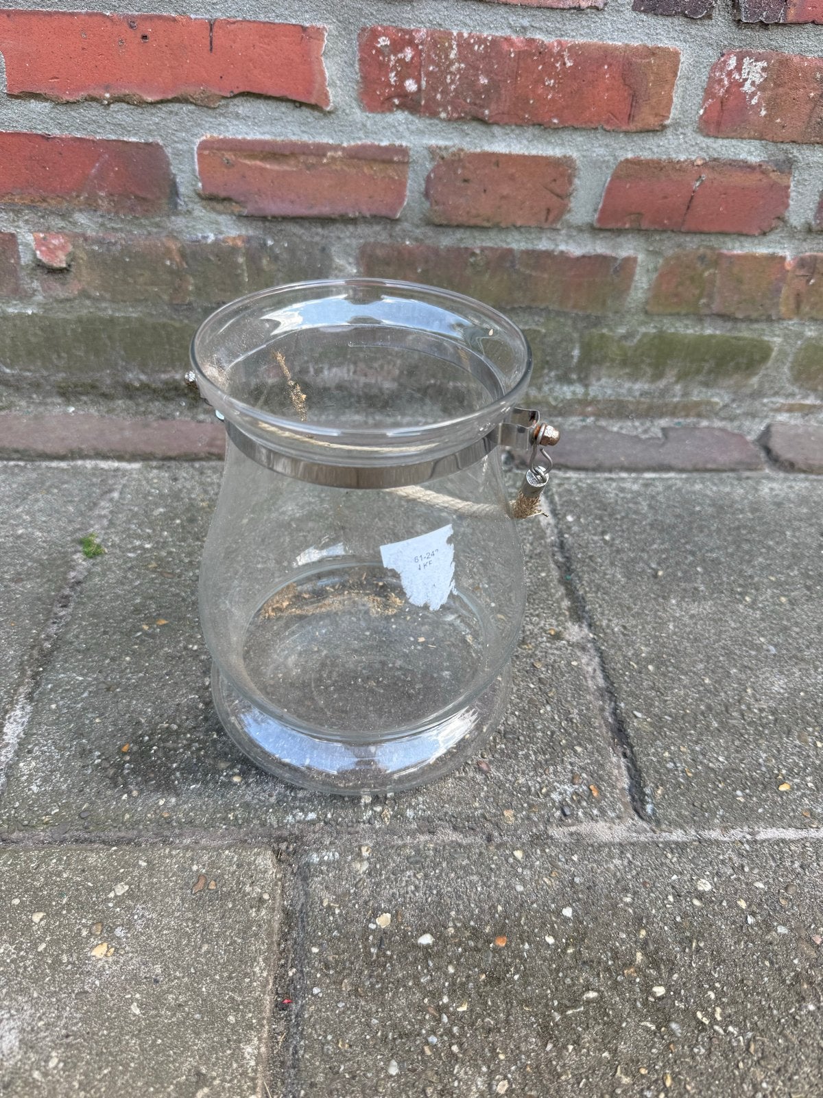 Glazen windlicht met metalen band en touw, Ophalen