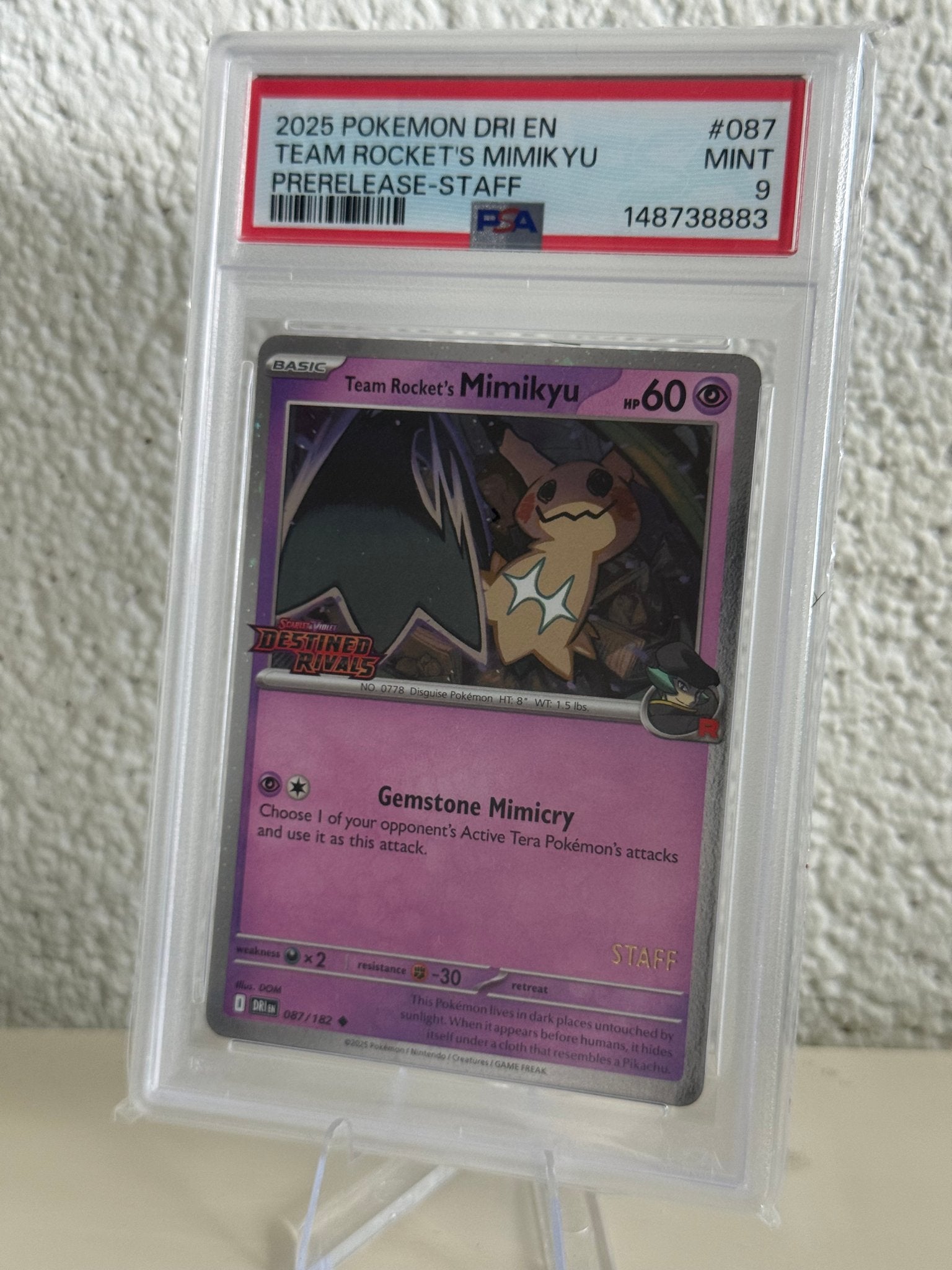 Pokemon Team Rocket's Mimikyu | PSA 9 | 087/182 | 148738883, Ophalen of Verzenden, Zo goed als nieuw, Losse kaart