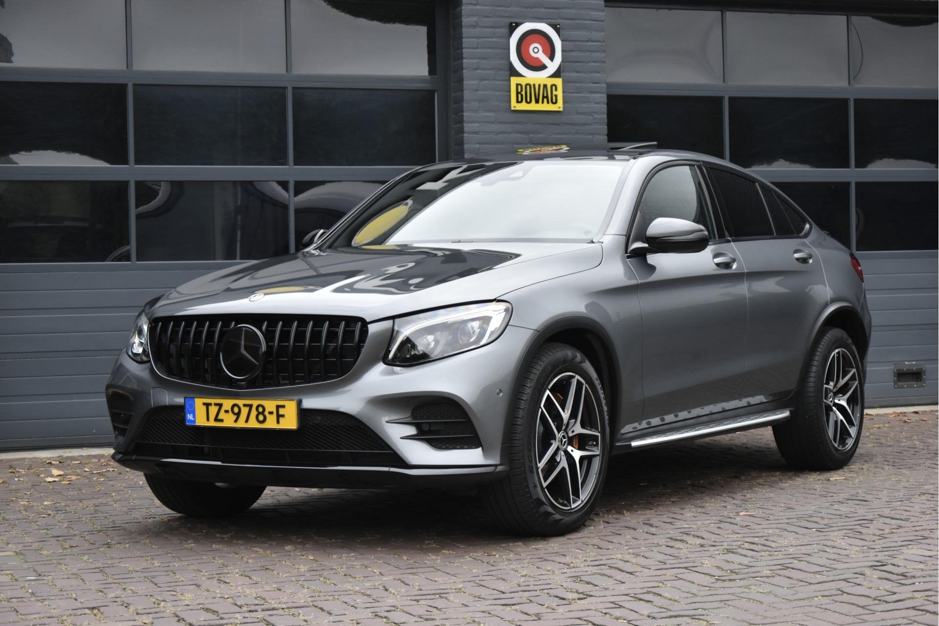 Mercedes-Benz GLC Coupé 250 4MATIC Premium Plus AMG, Auto's, 12 maanden, Gebruikt, 4 cilinders, Leder en Stof
