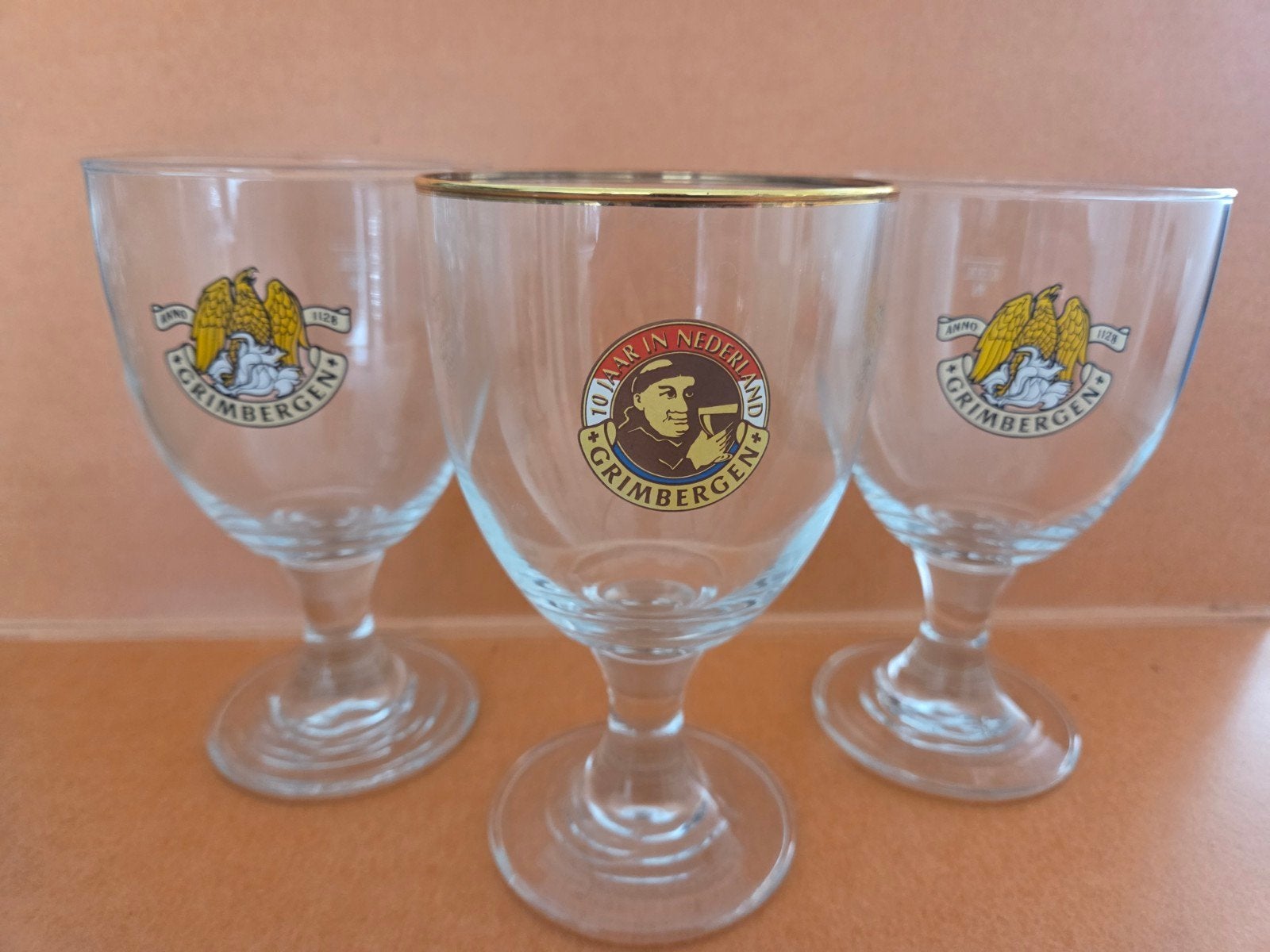 Set van 3 Grimbergen bierglazen - 10 jaar in Nederland, Gebruikt, Meerkleurig, Ophalen of Verzenden, Klassiek