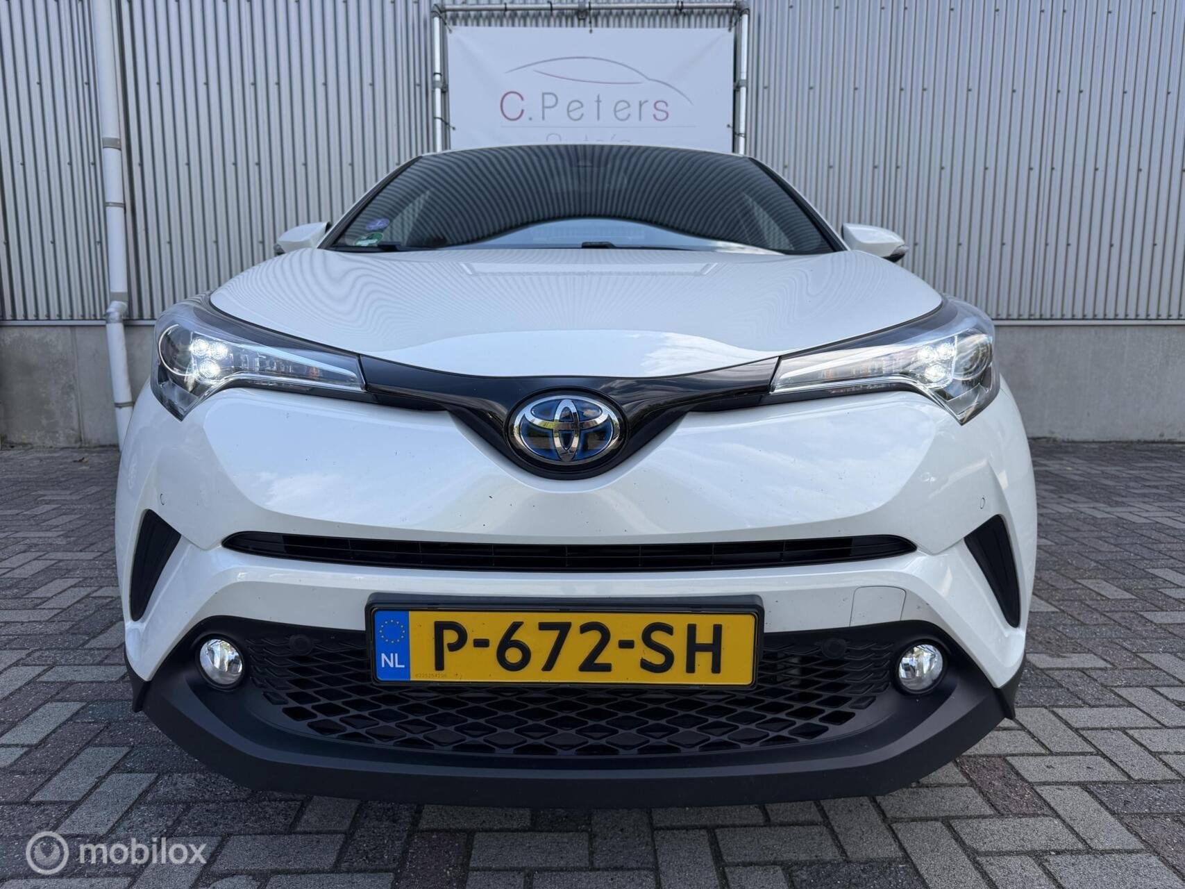 Toyota C-HR 1.8 Hybrid Dynamic 2018 / Camera / Leder / Keyle, Auto's, Dealer onderhouden, Euro 6, 4 cilinders, Leder
