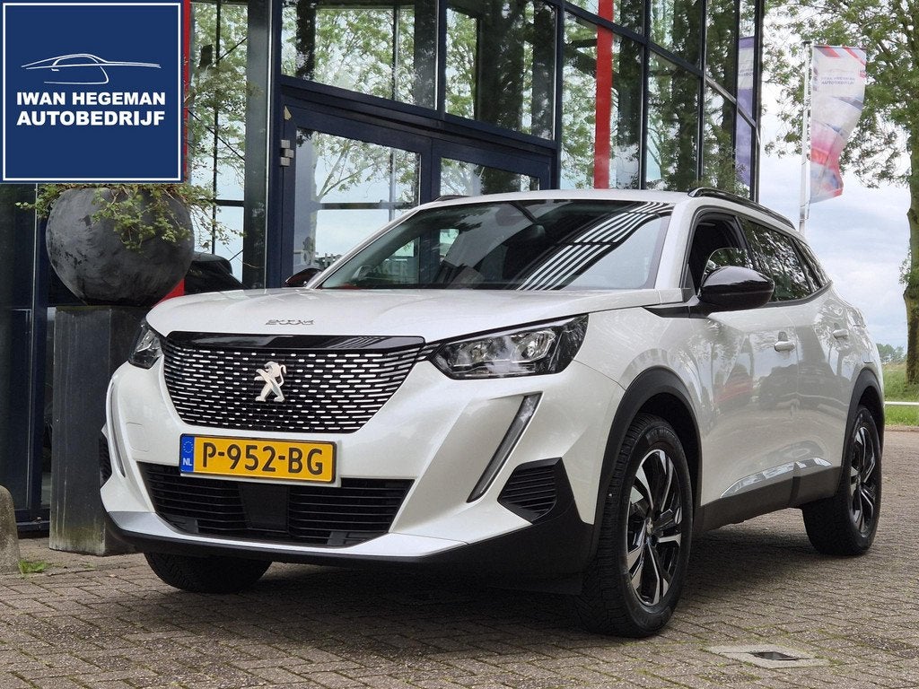 Peugeot 2008 1.2 PureTech 130PK Allure | Afn. Trekhaak | Nav, Auto's, Peugeot, 12 maanden, Euro 6, 1199 cc, Leder en Stof