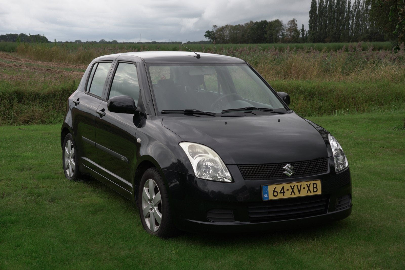 Suzuki Swift 1.3 5D 2007 Zwart, Auto's, Voorwielaandrijving, 40 €/maand, 965 kg, 400 kg
