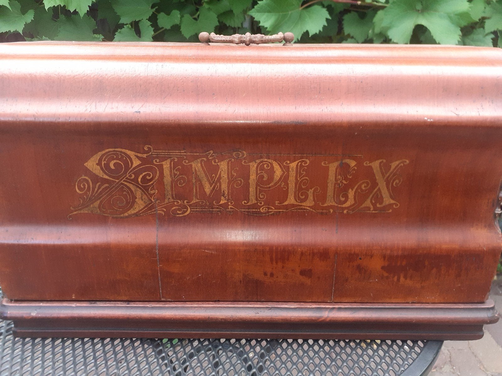 antieke Simplex naaimachine., Ophalen