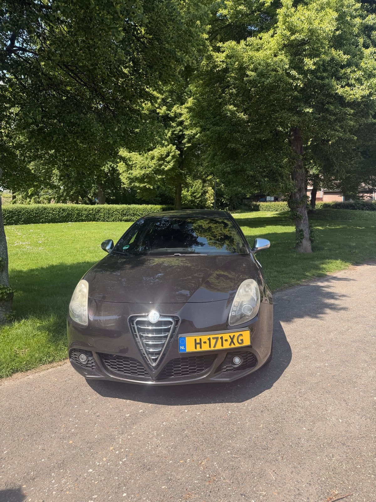 Alfa Romeo Giulietta 1.750 TBI 2012 Zwart, Auto's, 4 cilinders, Zwart, Stoelverwarming, Handgeschakeld