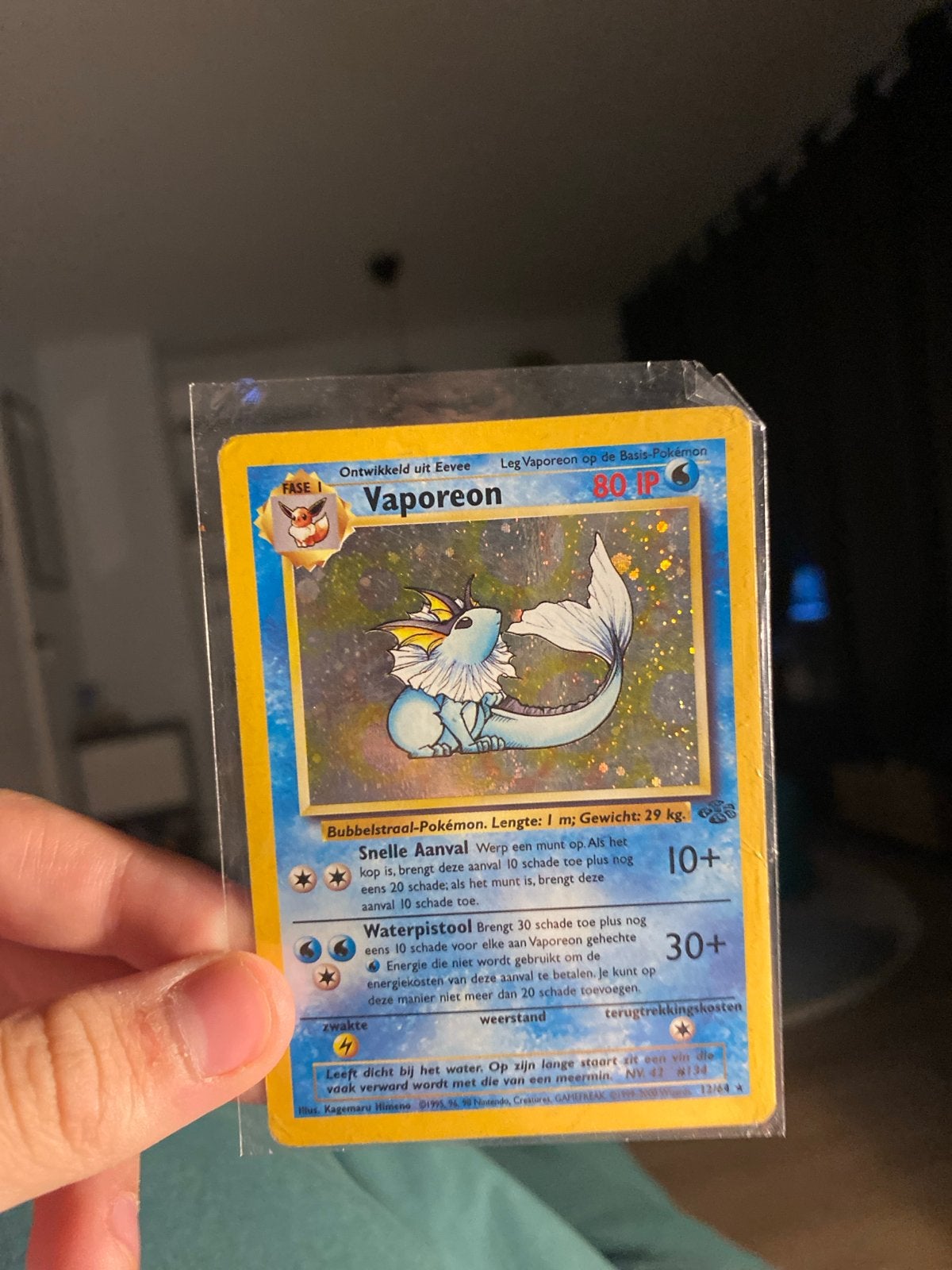 Vaporeon Pokémon kaart - 12/64, Hobby en Vrije tijd, Ophalen of Verzenden, Gebruikt, Losse kaart, Foil