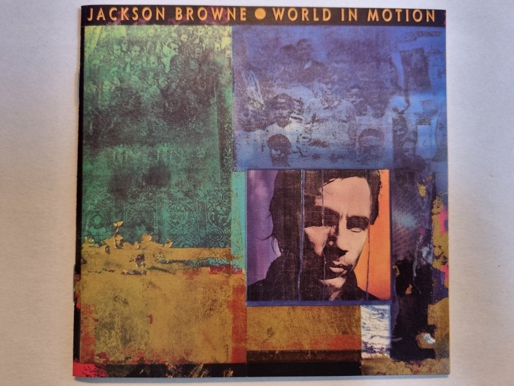 CD Jackson Browne - World In Motion (1989, izgs), Inclusief boekje, Singer-songwriter, Gebruikt, Ophalen of Verzenden