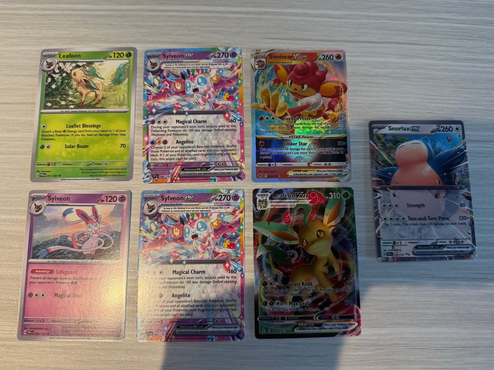Pokémon Kaarten Bundel - Sylveon, Leafeon, Simisear, Snorlax, Ophalen of Verzenden, Zo goed als nieuw, Meerdere kaarten, Foil