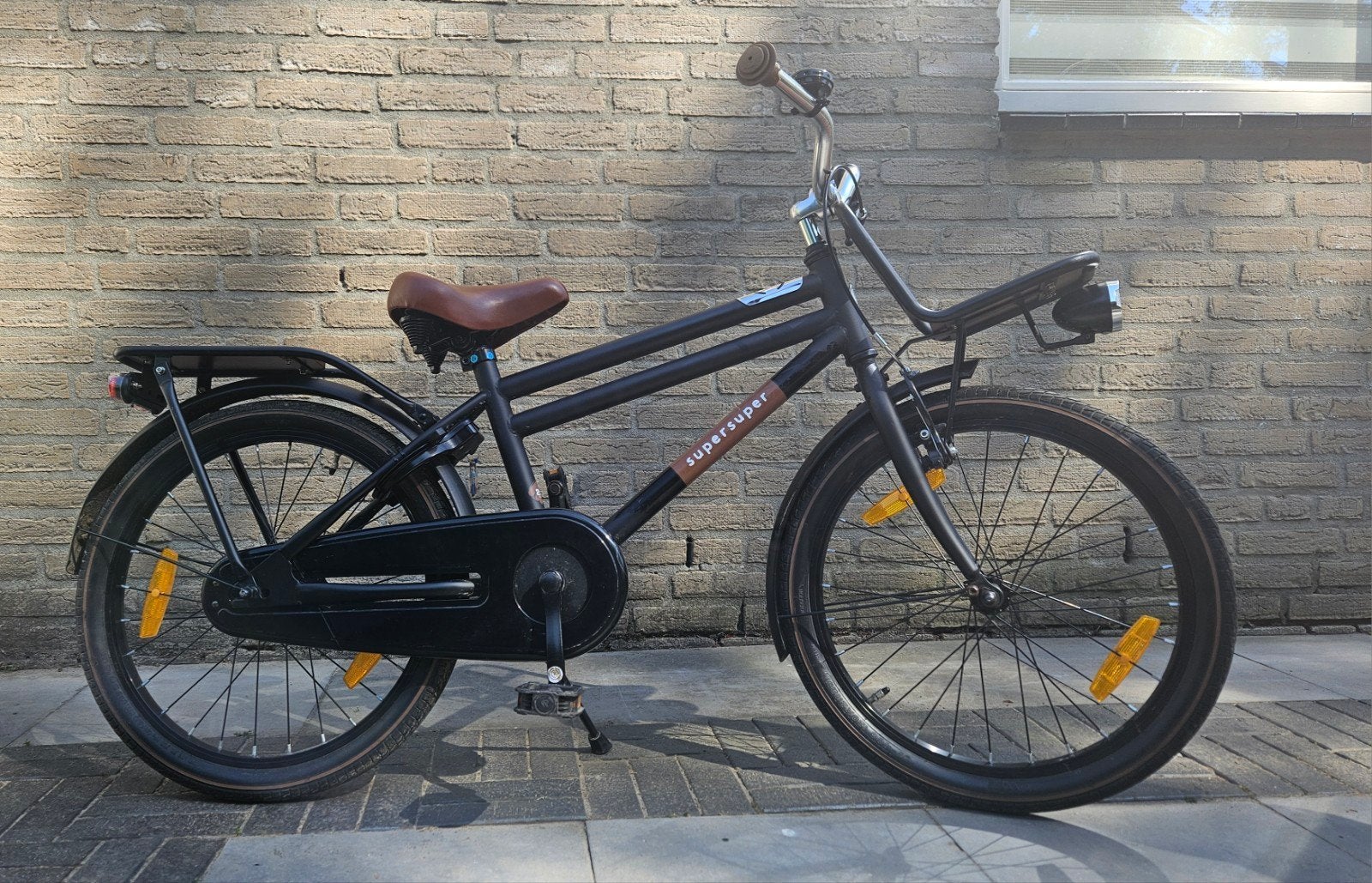 Zwarte SuperSuper Cooper 20 inch kinder transportfiets., 20 inch of meer, Velgrem, Zo goed als nieuw, Ophalen