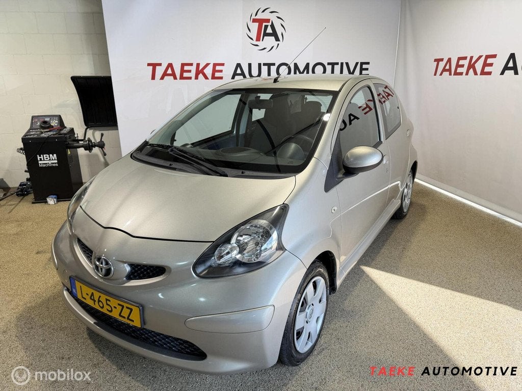 Toyota Aygo 1.0-12V Airco/Apk, Auto's, Voorwielaandrijving, Stof, Gebruikt, Bruin