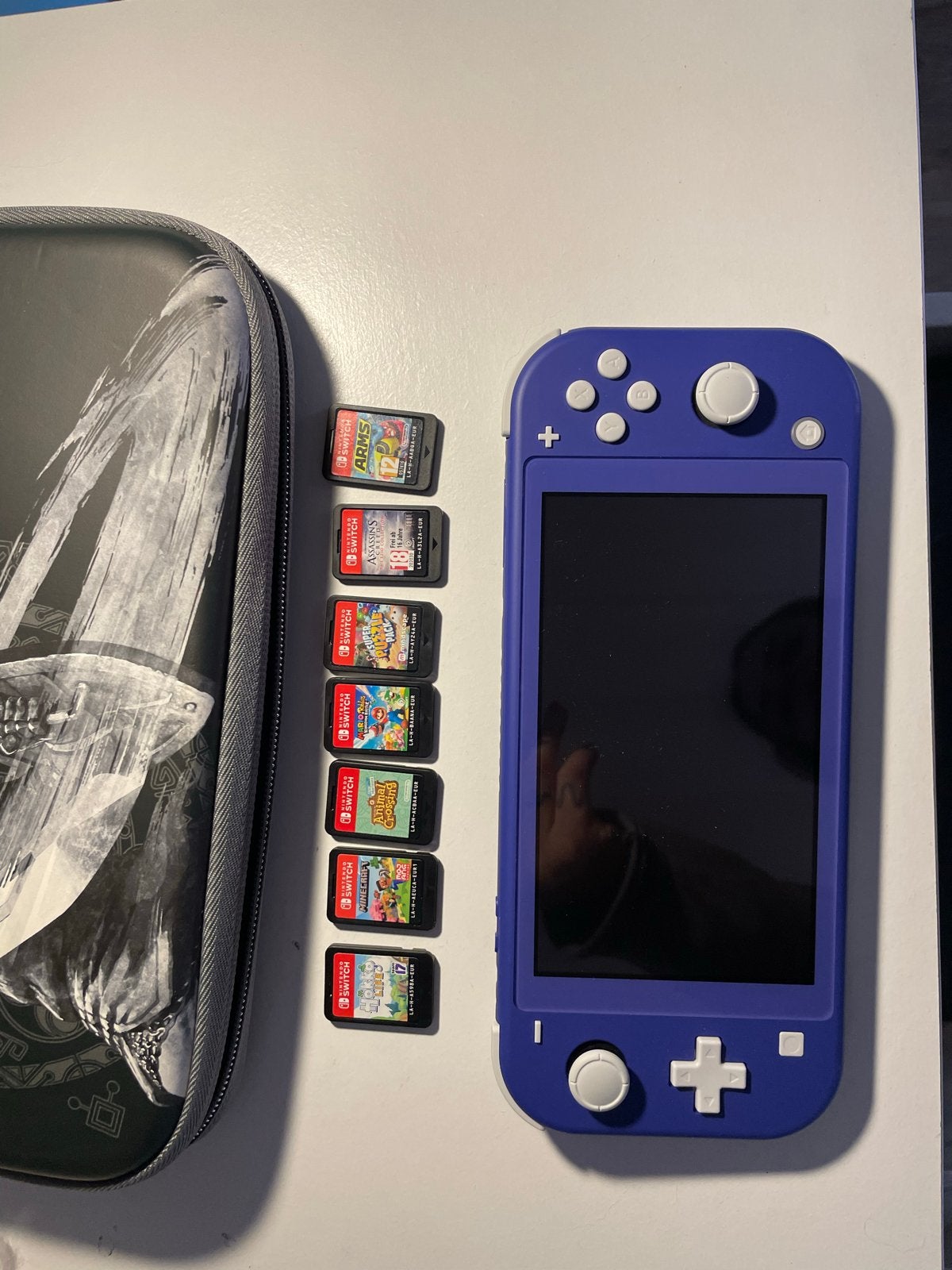 Nintendo Switch Lite blauw met 7 games en hoes, Met games, Verzenden, Zo goed als nieuw, Switch Original