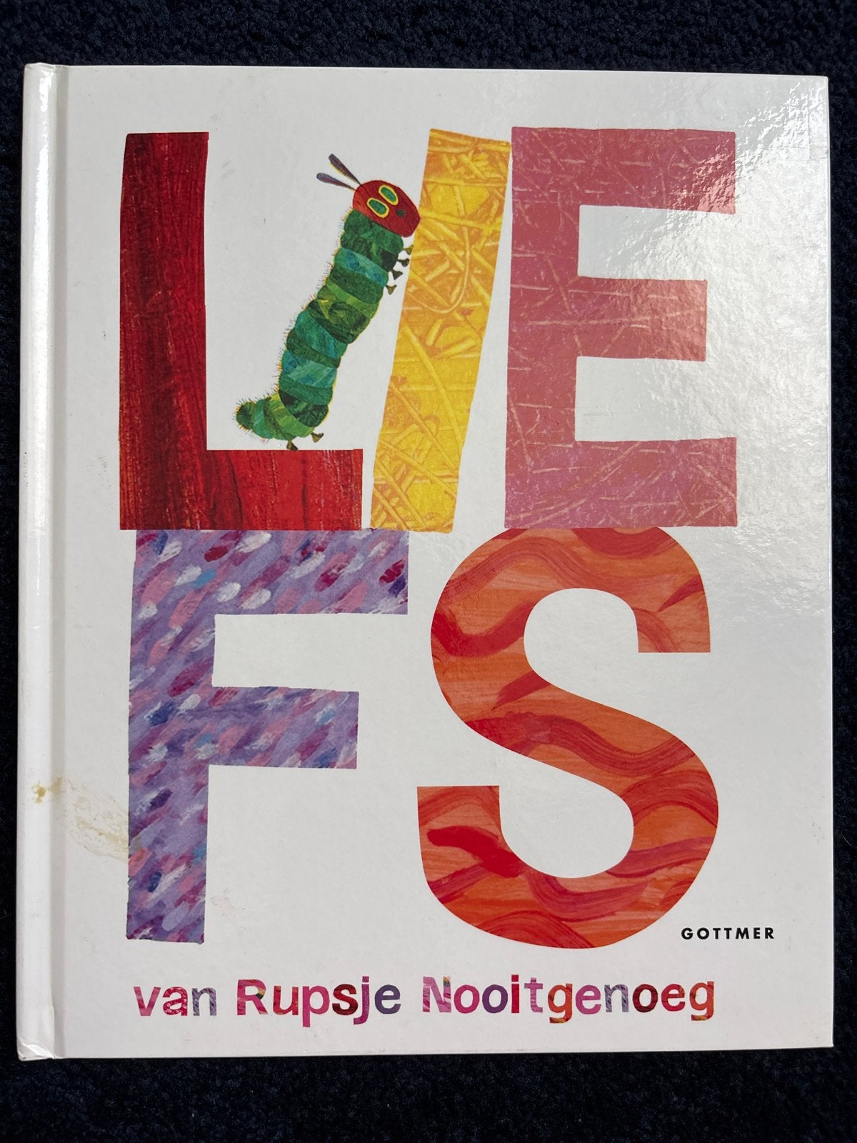 Liefs van Rupsje Nooitgenoeg - Eric Carle, Ophalen of Verzenden, Zo goed als nieuw