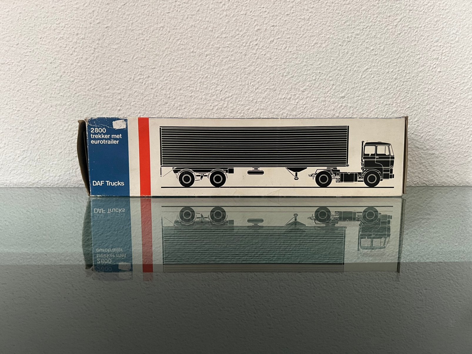 Lion Car nr.59 DAF trekker met eurotrailer De Haan, Hobby en Vrije tijd, Modelauto's | 1:50, Ophalen of Verzenden, Zo goed als nieuw