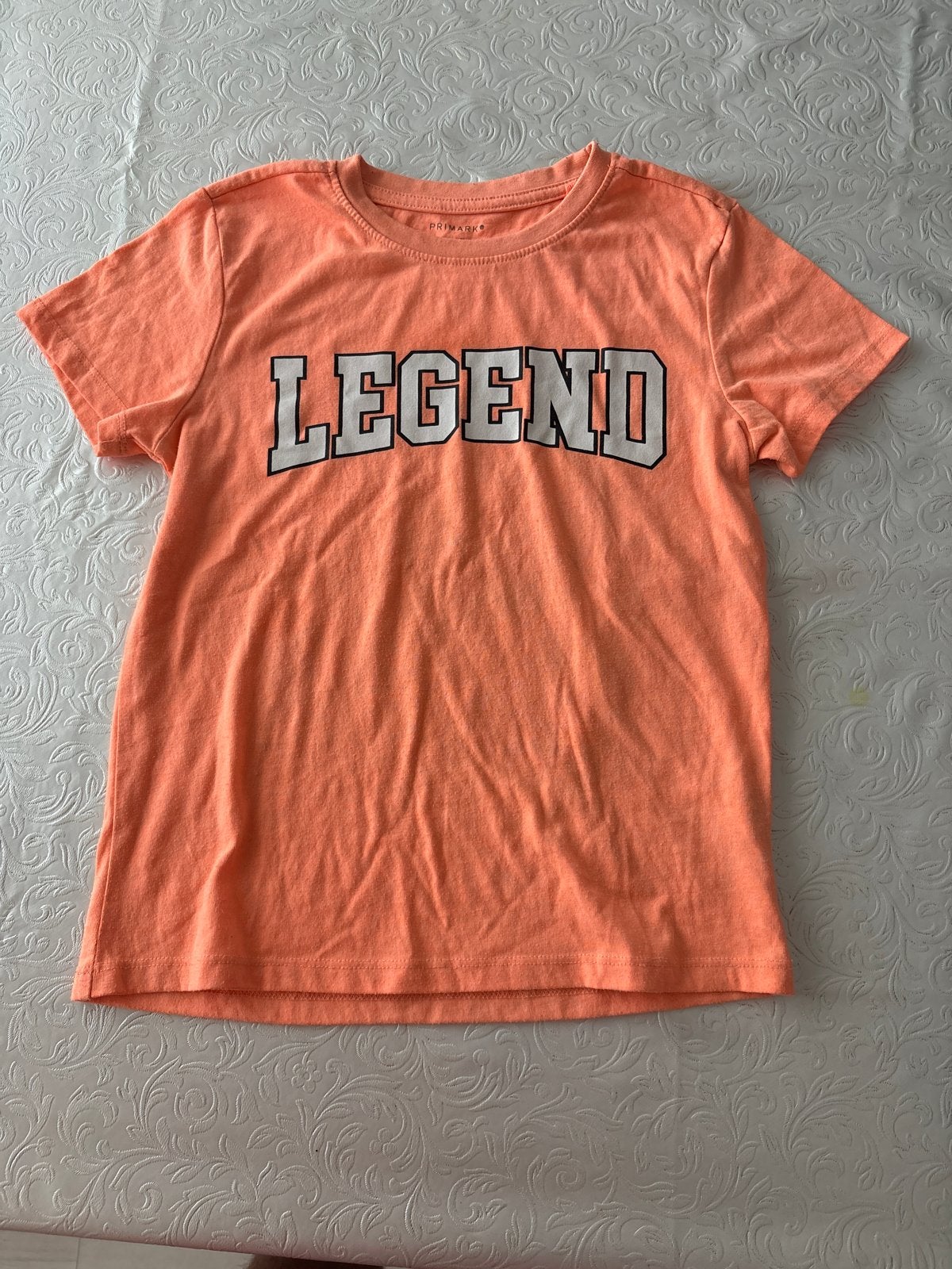 Primark T-shirt Oranje 'Legend' - Maat 128 (7-8 jaar), Ophalen of Verzenden, Gebruikt, Jongen of Meisje, Shirt of Longsleeve