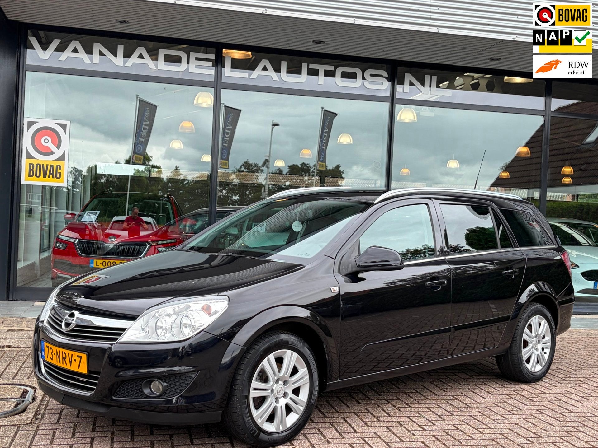 Opel Astra Wagon 1.6 Cosmo Leer Navi Clima Cruise Trekhaak N, Voorwielaandrijving, Euro 5, Gebruikt, Zwart