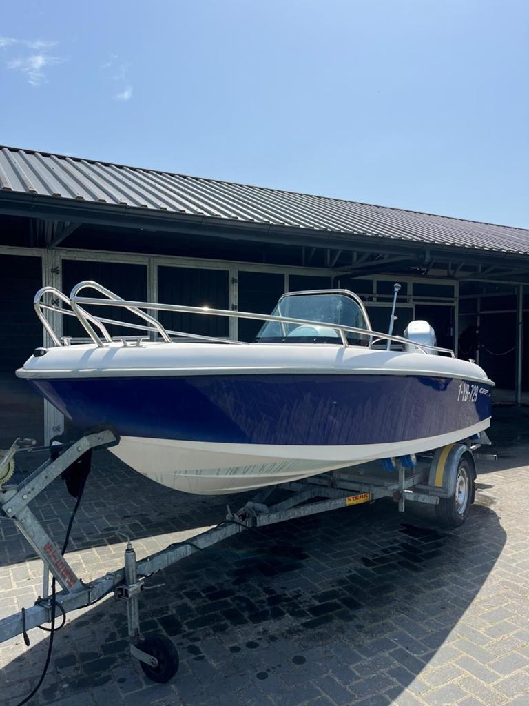 Consoleboot met Honda 50 PK buitenboordmotor en trailer, Watersport en Boten, Benzine, Overige merken, Gebruikt, Buitenboordmotor