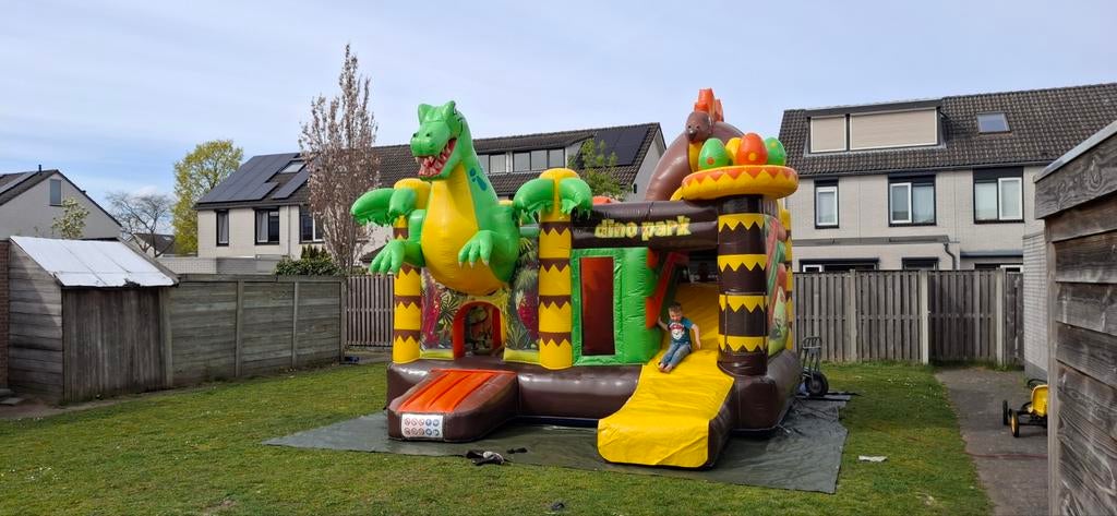 Mooie Dino springkussen te huur., Ophalen, Zo goed als nieuw