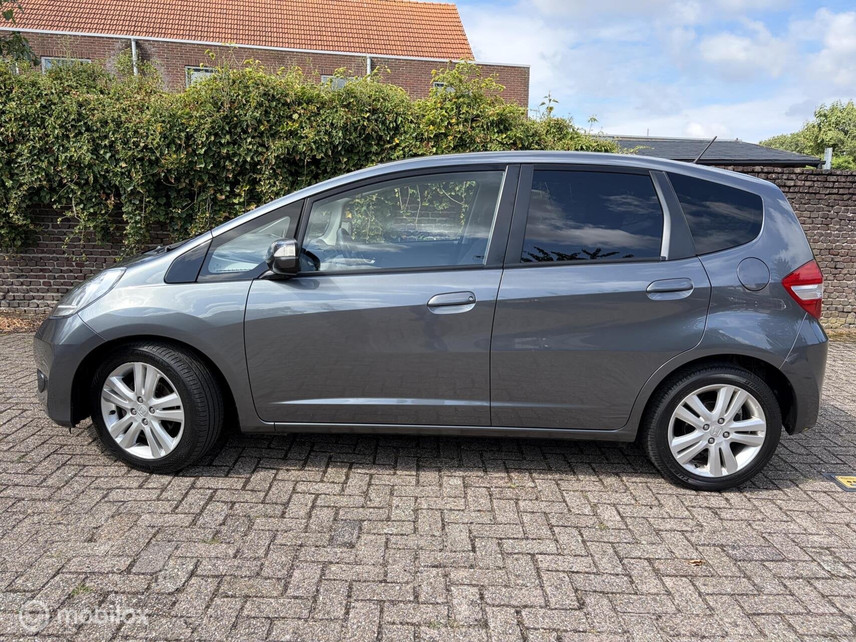 Honda Jazz 1.4 Elegance AUTOMAAT Climate control / APK 05-27, Auto's, Euro 5, Stof, Gebruikt, Zwart