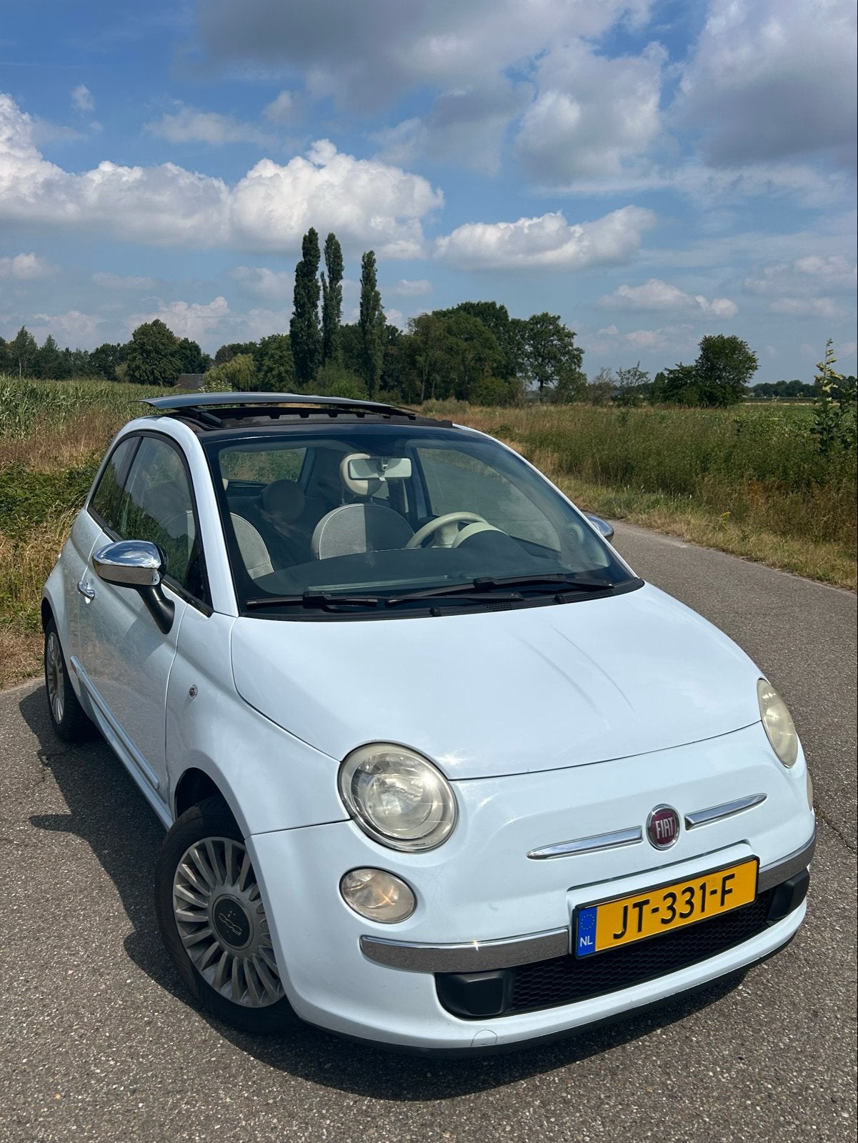 Fiat 500 1.2 Automaat Duologic | Schuifdak | Lichtblauw, Stof, 4 cilinders, 69 pk, 23 €/maand