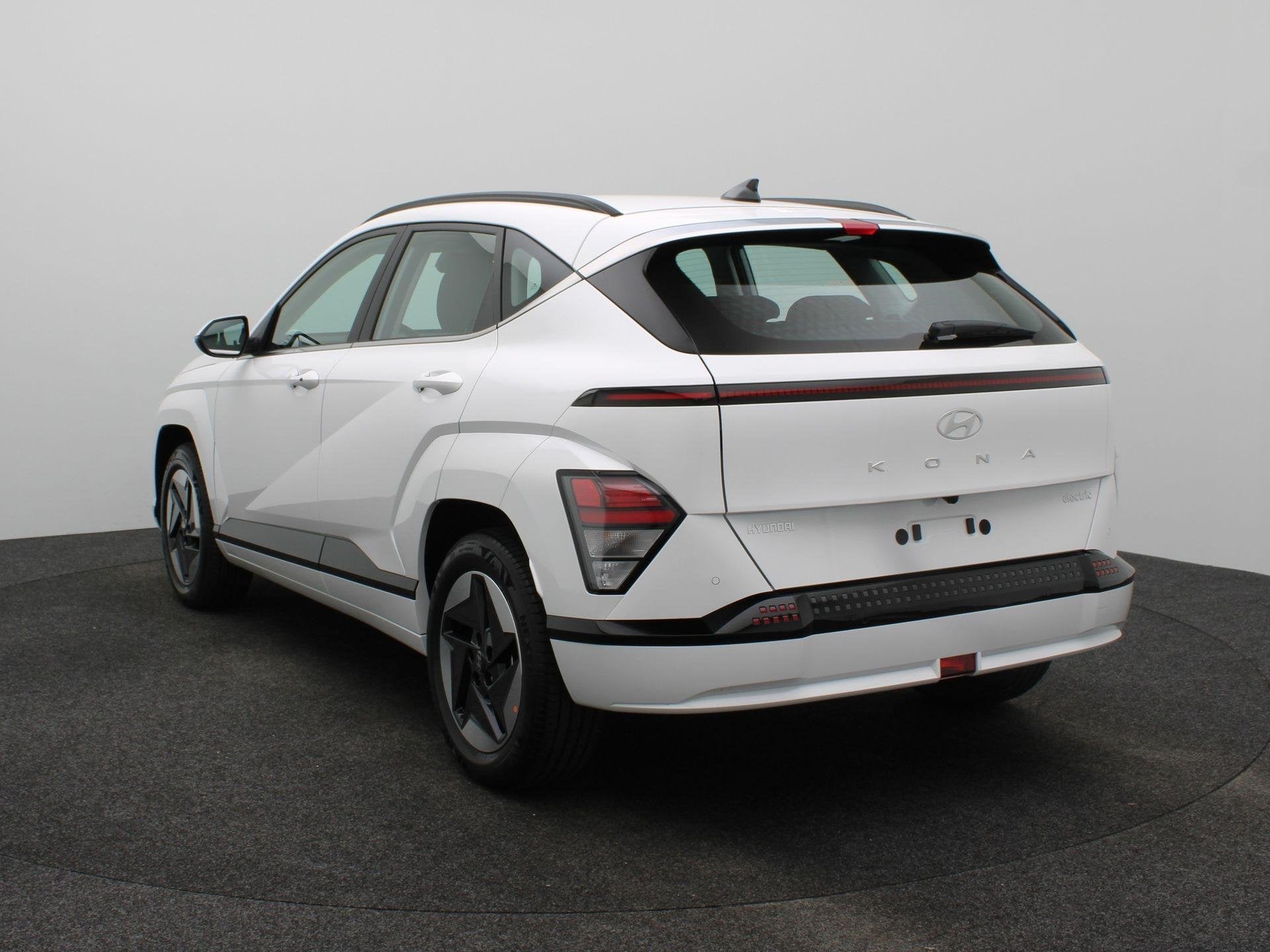 Hyundai Kona Electric Comfort 64.8 kWh | Uit Voorraad Leverb, Auto's, Stof, Met garantie (alle), Wit, 510 km