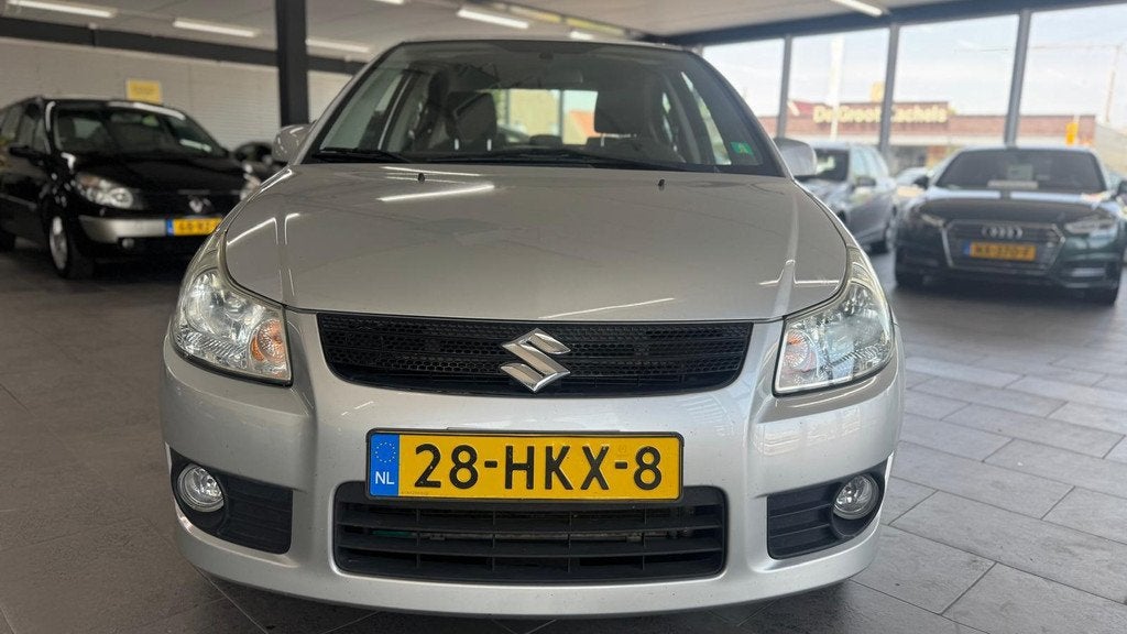 Suzuki SX4 1.6 Comfort automaat 128dzkm nap airco lm-velgen, Auto's, Suzuki, Stof, Gebruikt, Zwart, 4 cilinders
