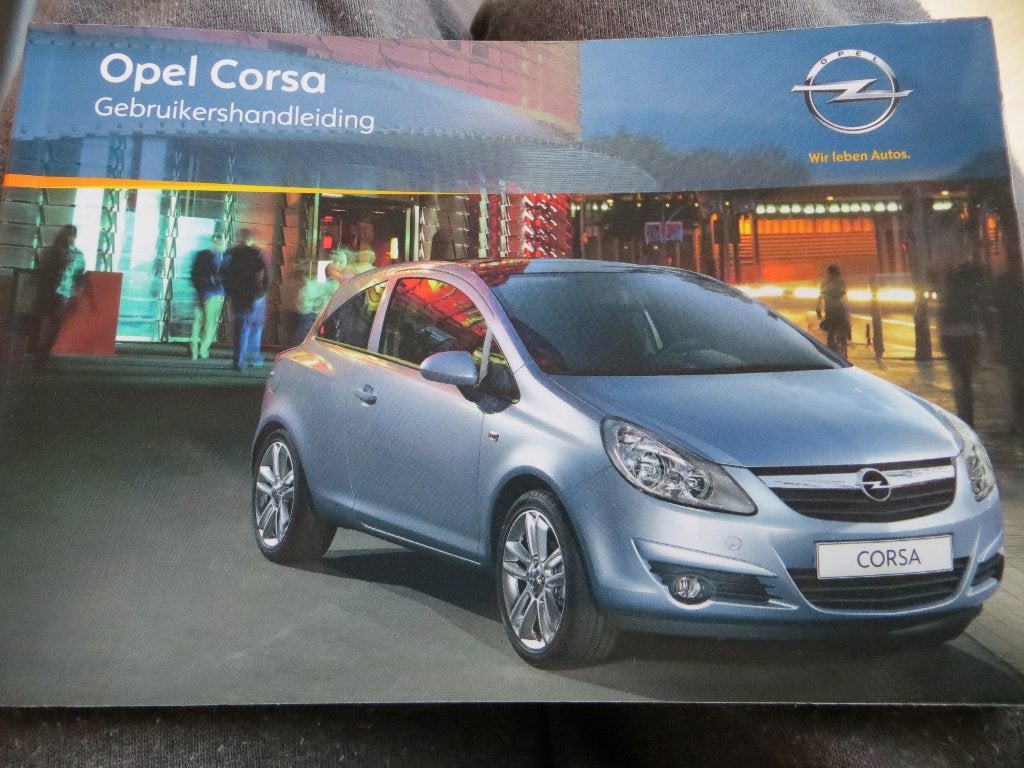 Instructieboek Opel Corsa 2010 + audio/navigatie, set, Auto diversen, Ophalen of Verzenden