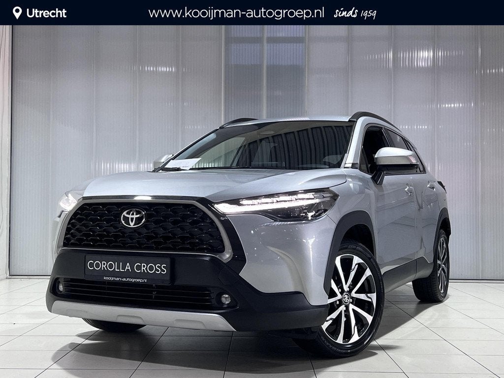 Toyota Corolla Cross Hybrid 140 Dynamic Adaptieve cruise con, Auto's, Stof, Gebruikt, 4 cilinders, Automatische klimaatregeling