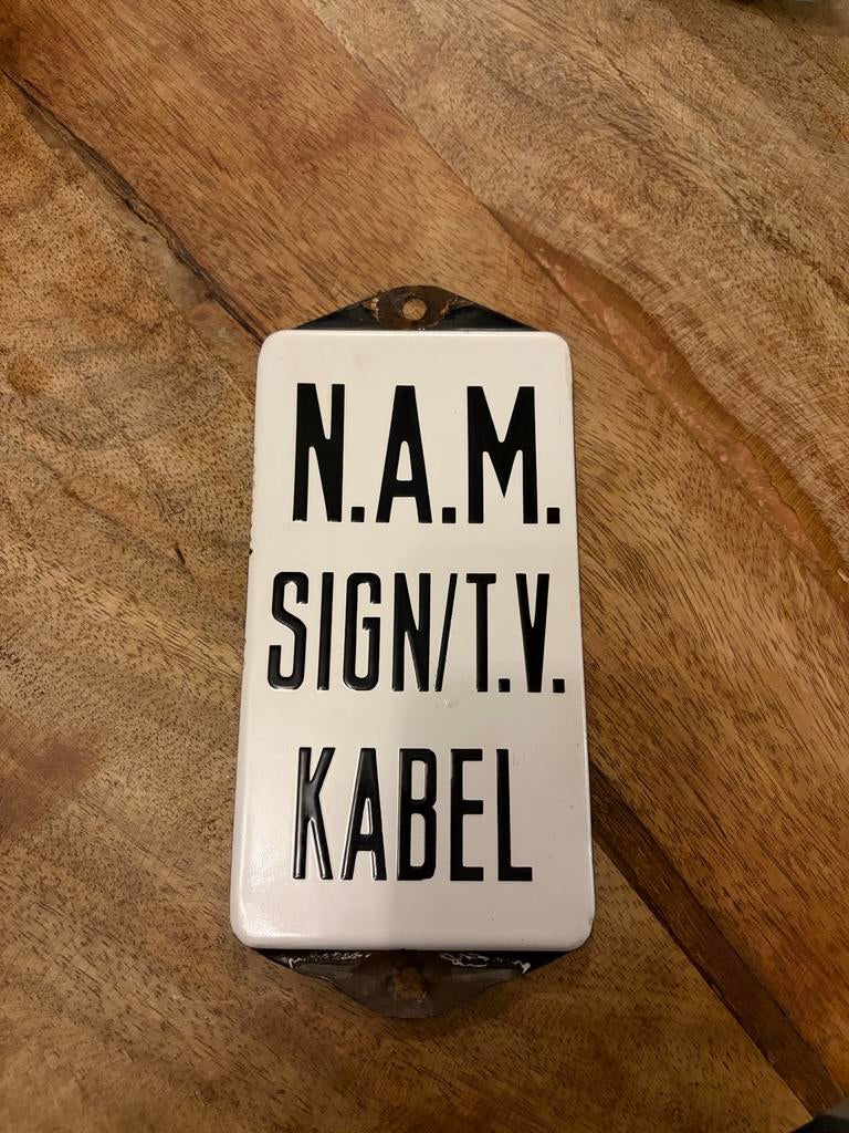 Emaille reclame bord / deurpostje N.A.M. Zwart wit, Ophalen of Verzenden, Gebruikt, Reclamebord