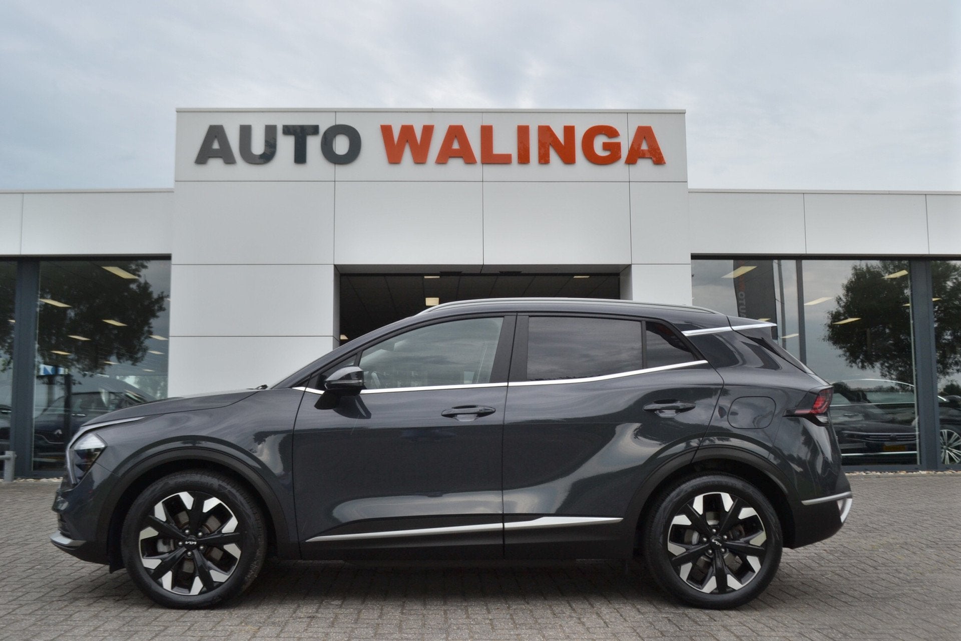 Kia Sportage 1.6 T-GDi Plug-in Hybrid AWD DynamicLine Achter, Auto's, Automaat, Stof, Gebruikt, 4 cilinders