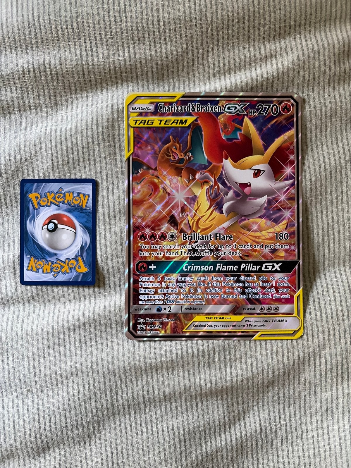 Pokémon Kaart: Charizard & Braixen GX TAG TEAM SM230, Ophalen of Verzenden, Zo goed als nieuw, Losse kaart