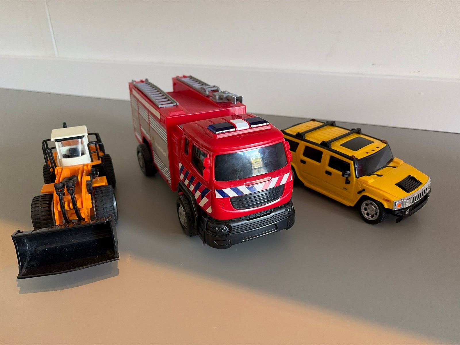 Speelgoedvoertuigen: Brandweerwagen, Graafmachine, Hummer, Ophalen of Verzenden, Gebruikt