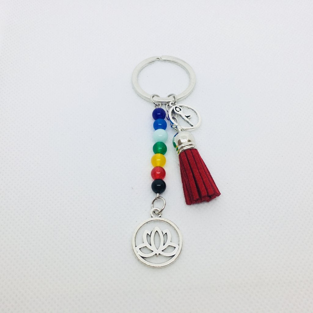 Chakra sleutelhanger met lotus en rood suède kwastje, Ophalen of Verzenden, Nieuw