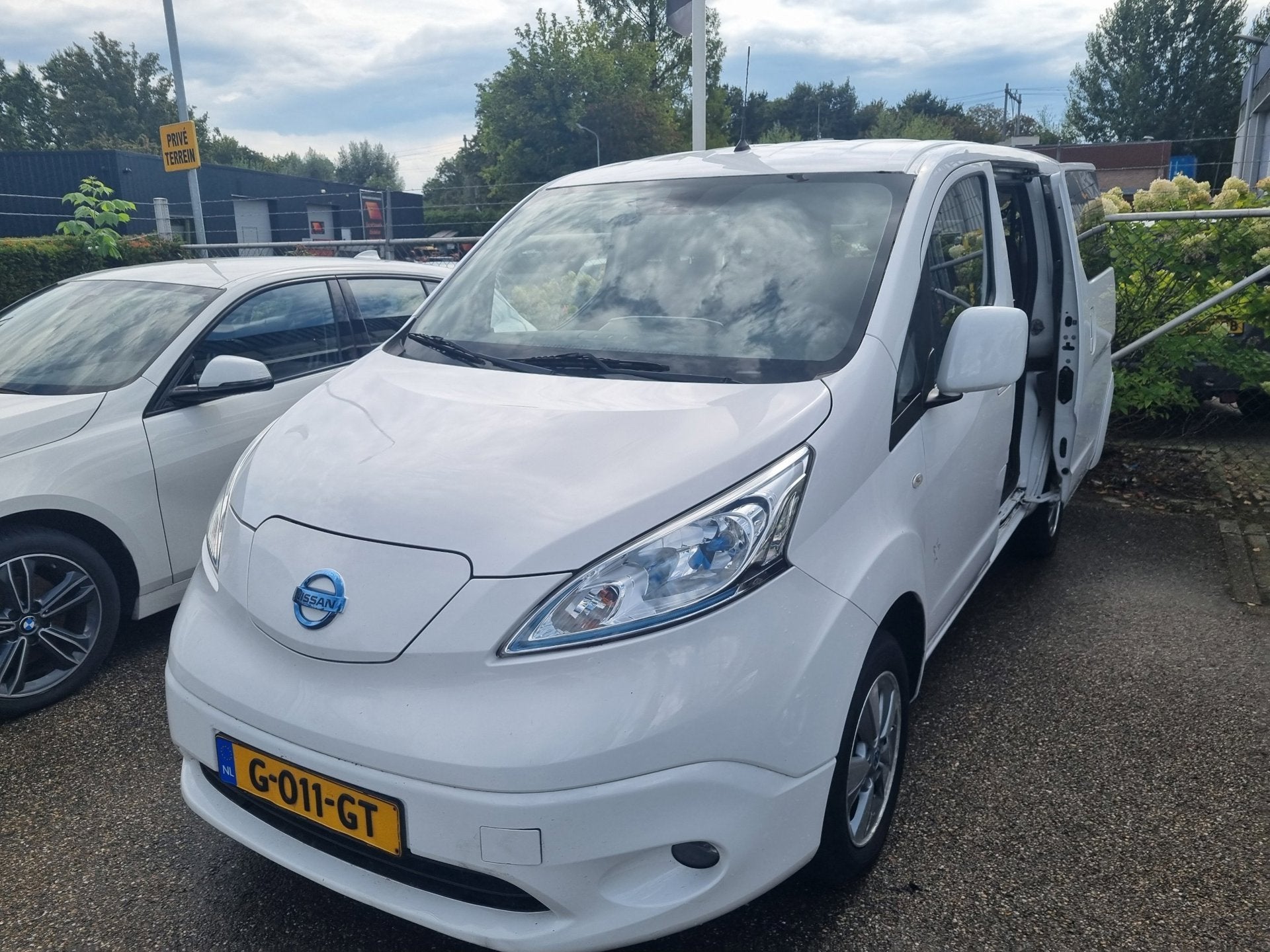 Nissan E-NV200 Evalia 40 kWh Connect Edition 7p, Auto's, Stof, Gebruikt, Zwart, Stoelverwarming