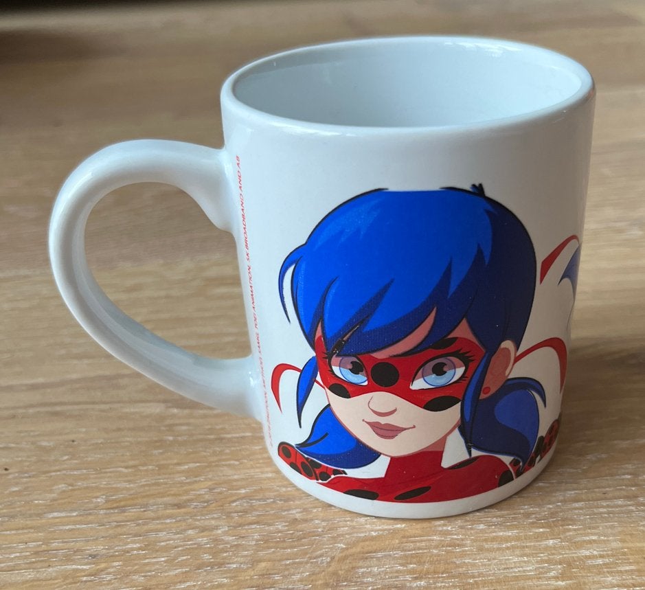 Ladybug Miraculous mok - Zo goed als nieuw, Overige typen, Ophalen of Verzenden, Zo goed als nieuw, Steen/keramiek