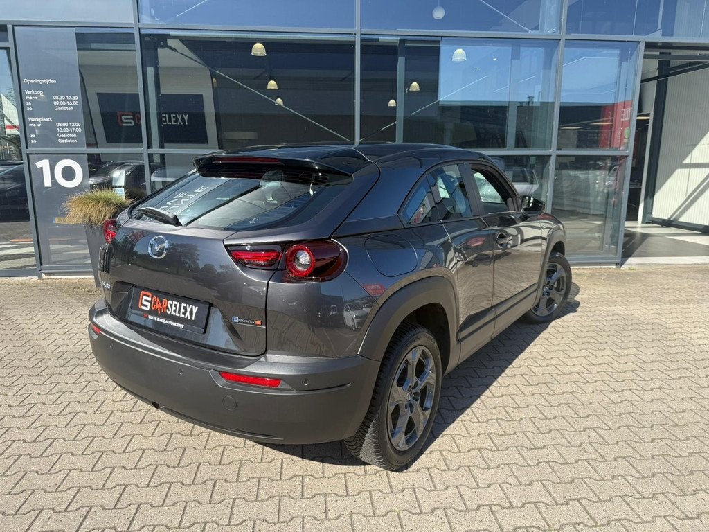 Mazda MX-30 e-SkyActiv R-EV 170 Exclusive-line *Plug-in*, Auto's, Mazda, 12 maanden, Stof, Gebruikt, Automatische klimaatregeling