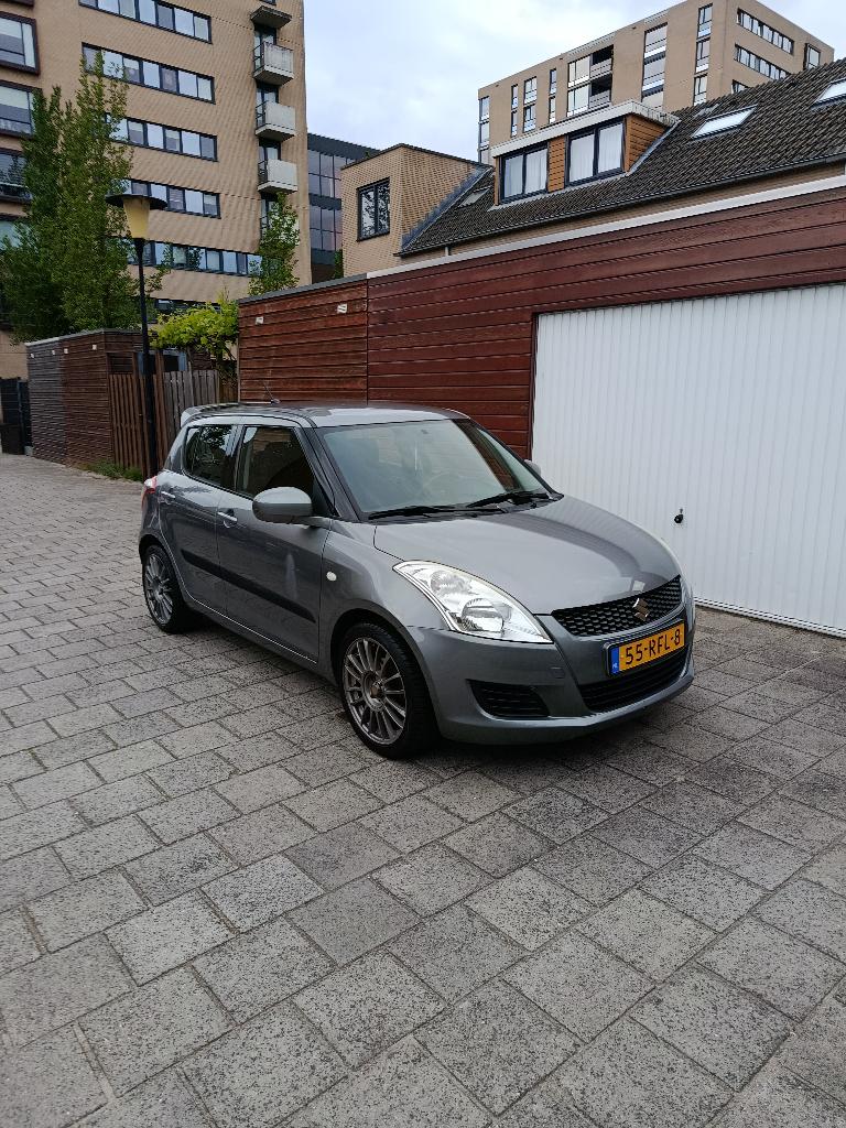 Suzuki Swift 1.2 5-D 2011 Grijs, Voorwielaandrijving, Stof, 4 cilinders, 400 kg