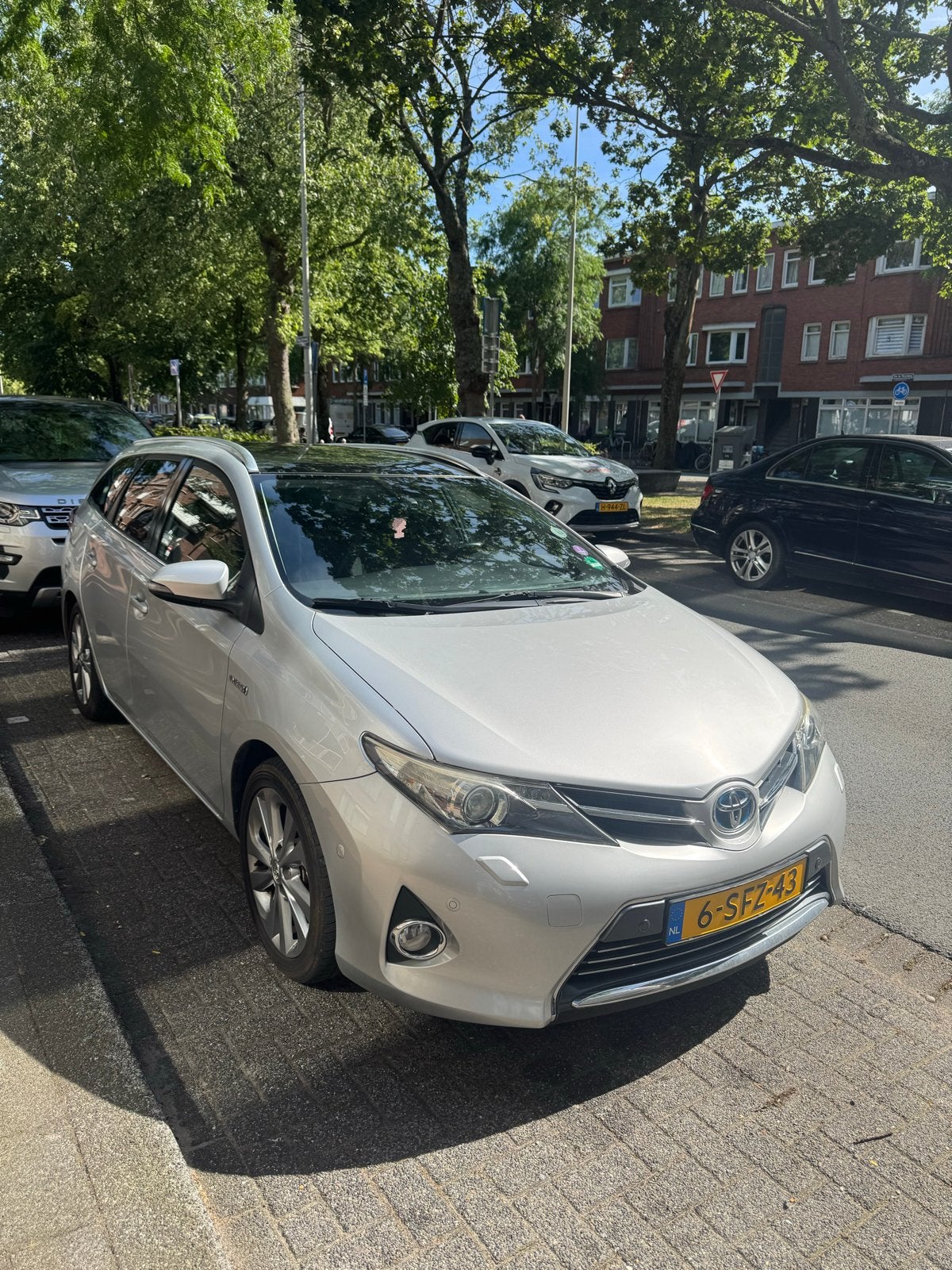 Toyota Auris 1.8 Hybrid Touring Sports inc BOVAG  2013 Grijs, Auto's, 345 kg, Origineel Nederlands, 25 km/l, Te koop