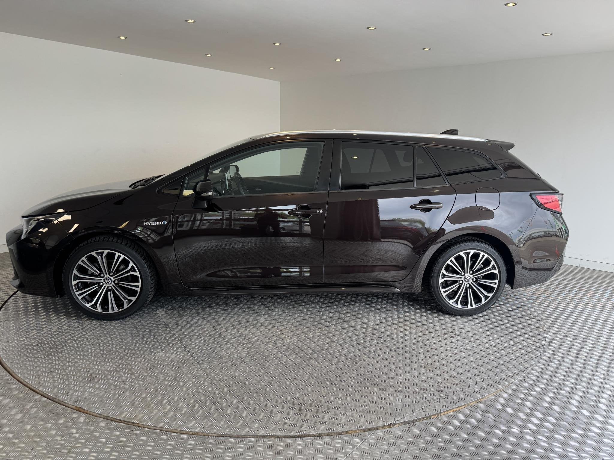 Toyota Corolla Touring Sports 1.8 Hybrid Business Plus, Auto's, Gebruikt, Bruin, Corolla, 122 pk