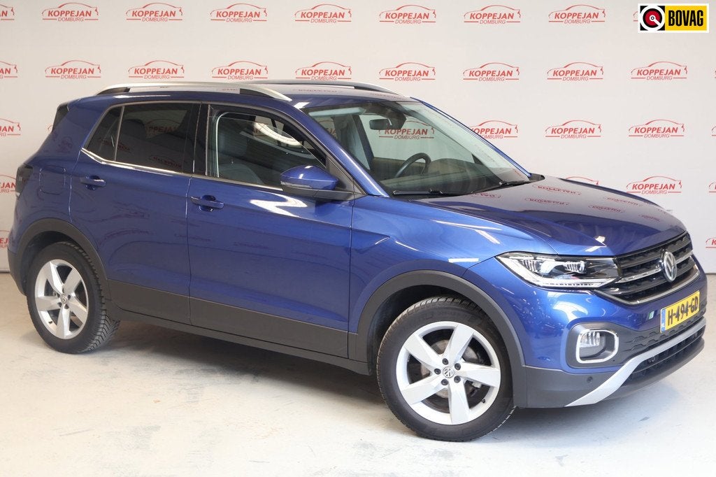 Volkswagen T-Cross 1.0 TSI Style NL auto, ACC, Trekhaak, App, Auto's, Volkswagen, Gebruikt, Blauw, 116 pk, 1175 kg