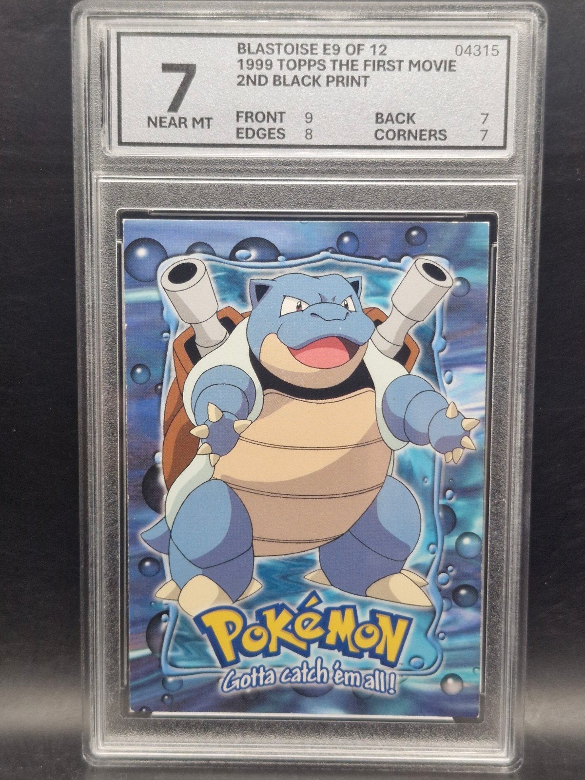 Blastoise 1999 topps the first movie #e9 woetoe grading 7, Verzenden, Zo goed als nieuw, Losse kaart