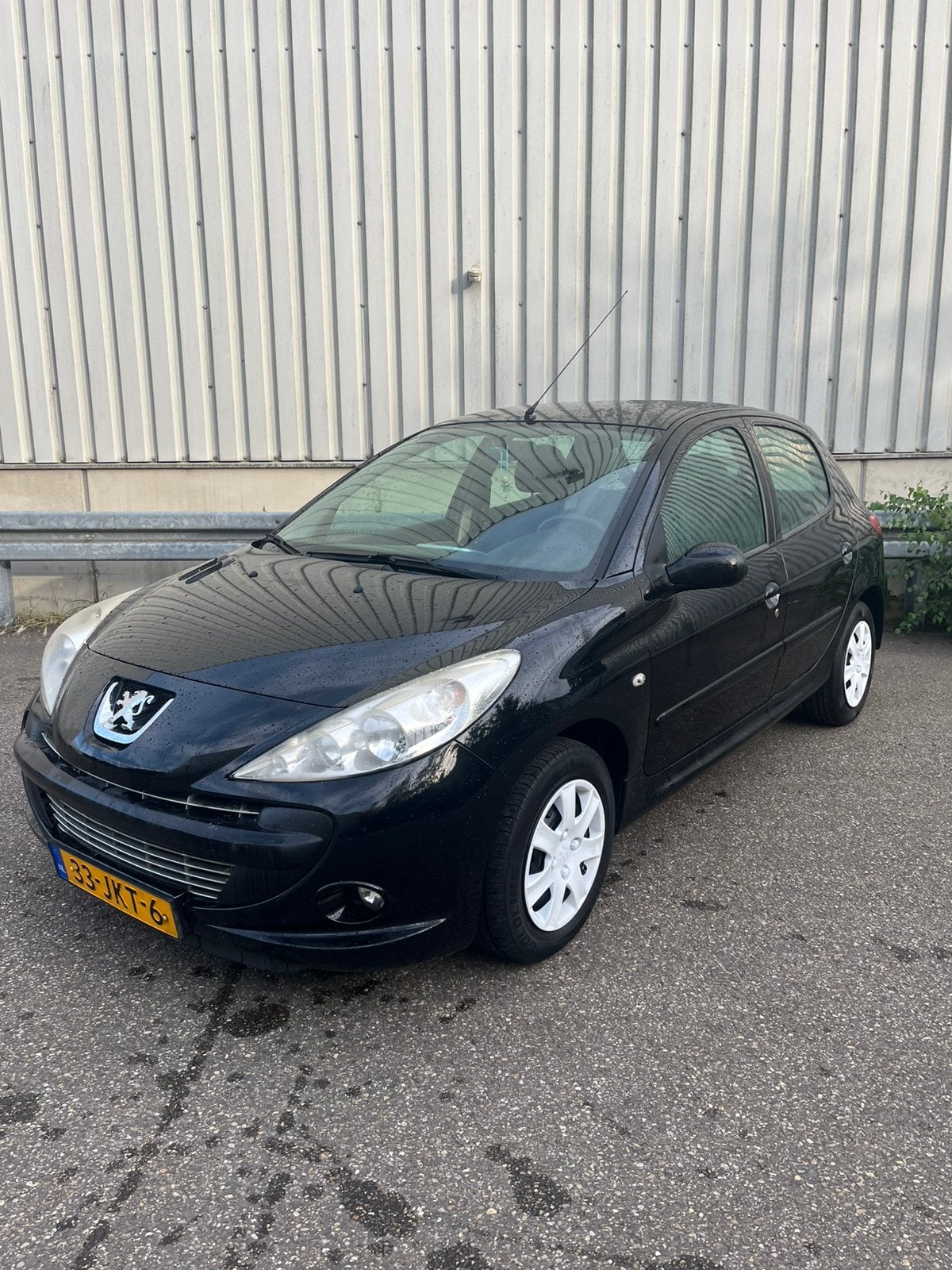 Peugeot 206+ 1.4 5D 2009 Zwart, Auto's, Voorwielaandrijving, 206+, Stof, 4 cilinders