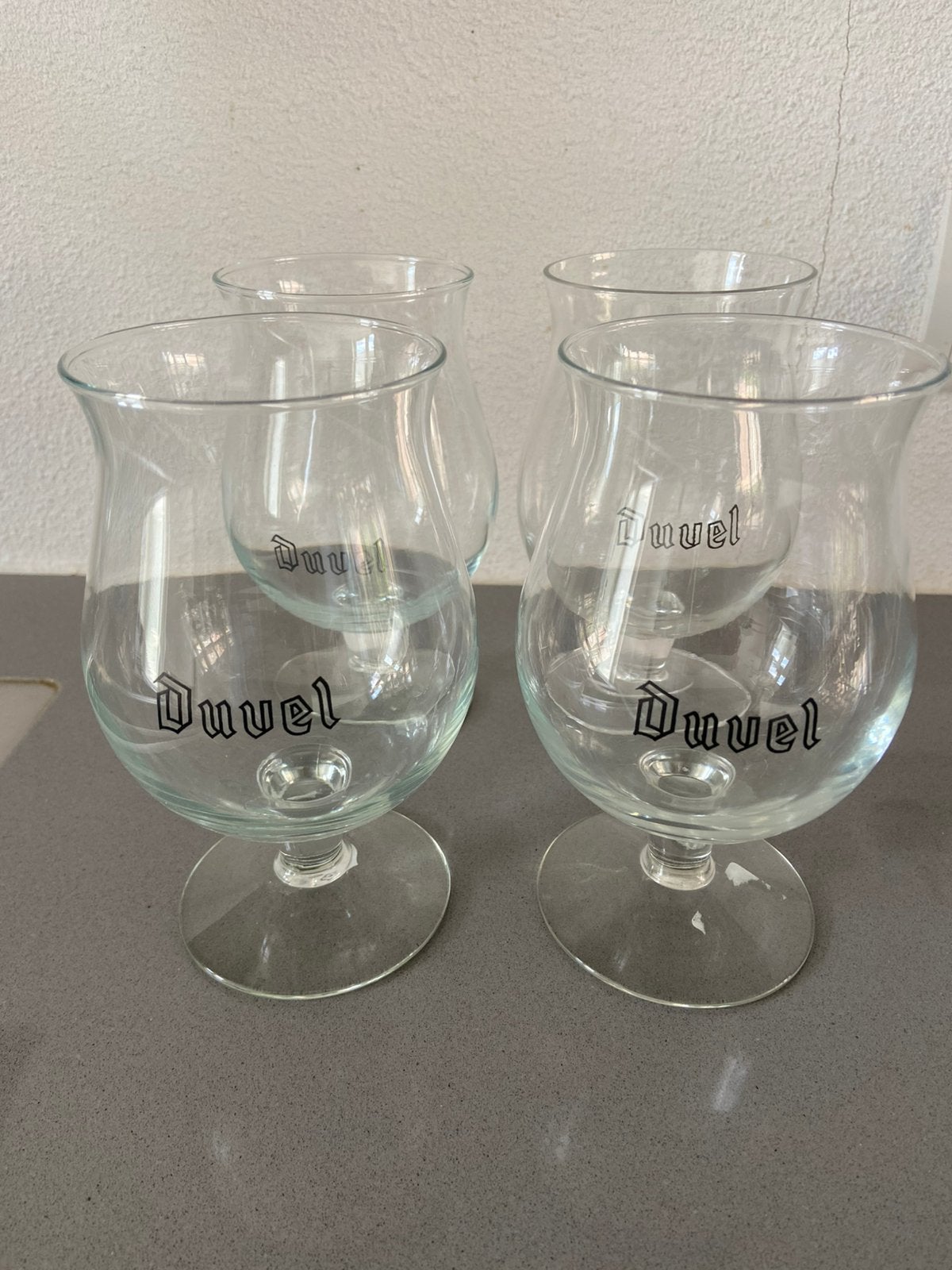 Vier Duvel bierglazen, doorzichtige D, Ophalen of Verzenden, Gebruikt, Bierglas
