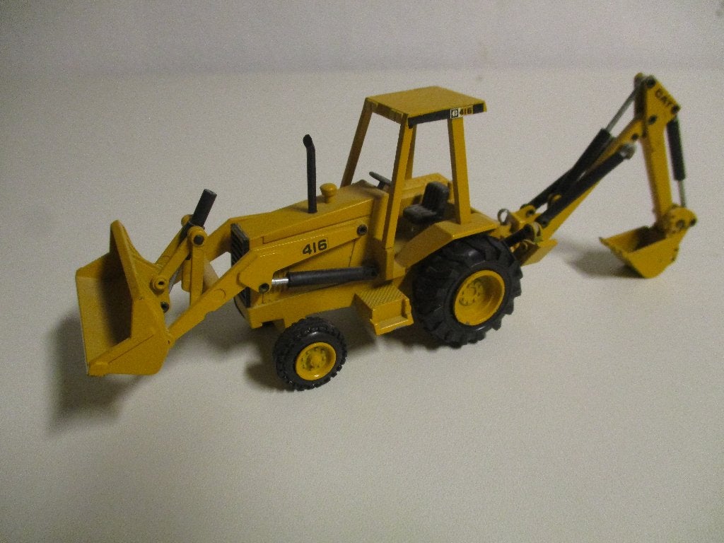 NZG Caterpillar 416 laad/ graafcombinatie, Hobby en Vrije tijd, Modelauto's | 1:50, Ophalen of Verzenden, Gebruikt, Hijskraan, Tractor of Landbouw