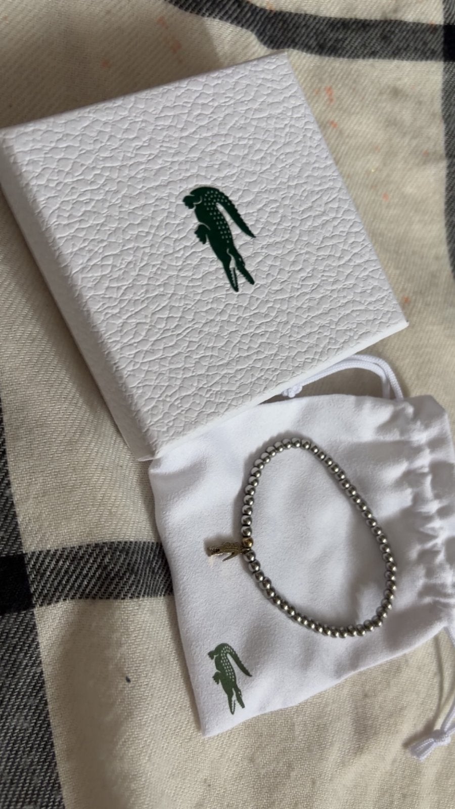 Lacoste Armband met Bedel - Zo goed als nieuw, Overige materialen, Verzenden, Zo goed als nieuw, Met bedels of kralen