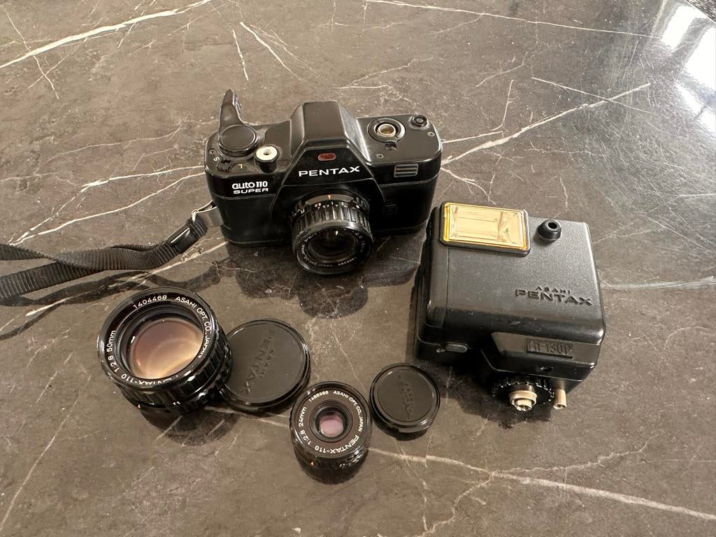 Pentax Auto 110 Super set + lenzen + flitser (vintage), Audio, Tv en Foto, Fotocamera's Analoog, Ophalen of Verzenden, Gebruikt