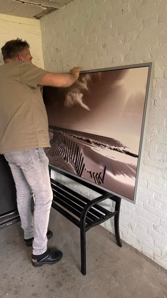 Groot schilderij strand met duinhekken, Ophalen